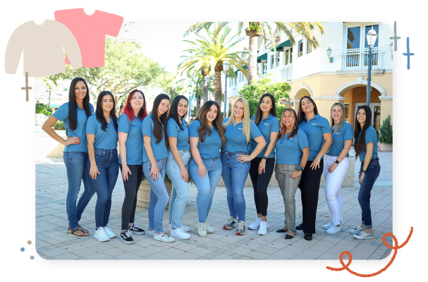 All of the therapists at Full Circle Therapy standing close together in a straight line. They are all wearing their uniform polos and smiling. 